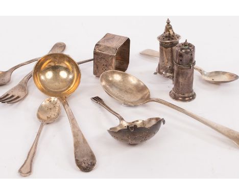 A small quantity of silver to include a sauce ladle, spoons, pepper pots and an Aesthetic movement napkin ring, gross weight 