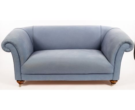 A modern two seater Chesterfield-type sofa, two armchairs and a footstool, upholstered in pale blue fabric, the sofa 180cm wi