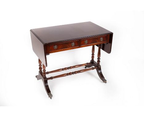 A mahogany two-flap sofa table fitted two drawers, on turned end standards and stretchers with splay feet, 147cm wide  CONDIT