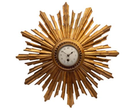 A 19th Century carved and gilt pine sunburst wall clock, the central circular enamel dial with Arabic numerals, a single trai