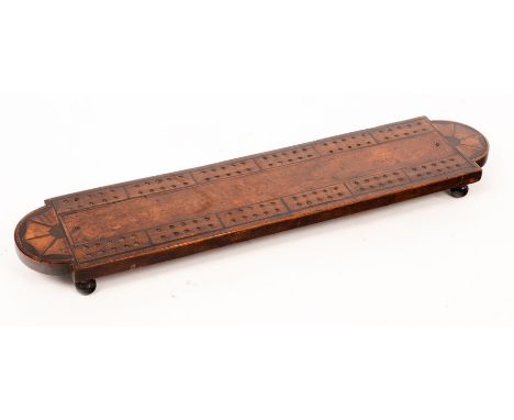 A fruitwood cribbage board, the rounded ends inlaid batwing patera, with pegs, 38cm wide CONDITION REPORT: Condition informat