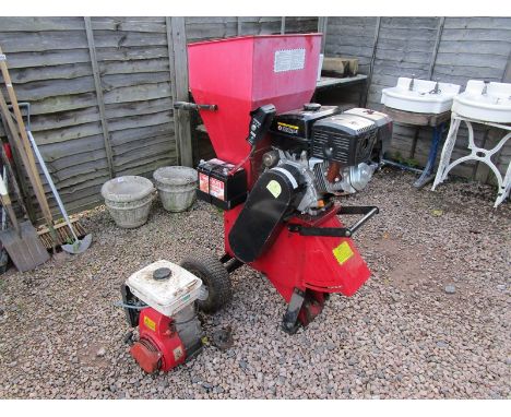 Petrol powered wood chipper with spare engine