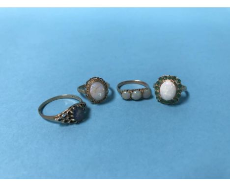 Four 9ct gold opal rings, 10g