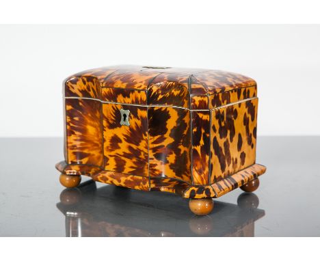 19TH CENTURY TORTOISESHELL TEA CADDY
the serpentine front with hinged cover above enclosing a fitted interior with two lidded