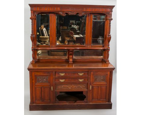 LARGE VICTORIAN WALNUT MIRROR BACK SIDEBOARD
the lofty raised back with a moulded cornice, three bevelled mirrors below with 