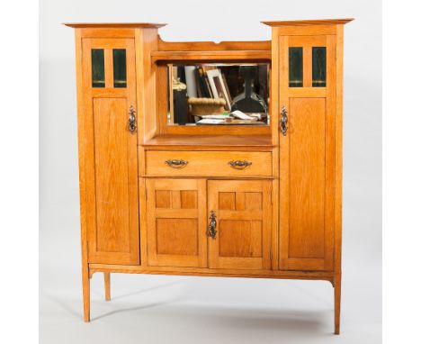 ARTS AND CRAFTS OAK SIDEBOARD 
the indented centre with open shelf, mirror below, central drawer with cupboard beneath enclos