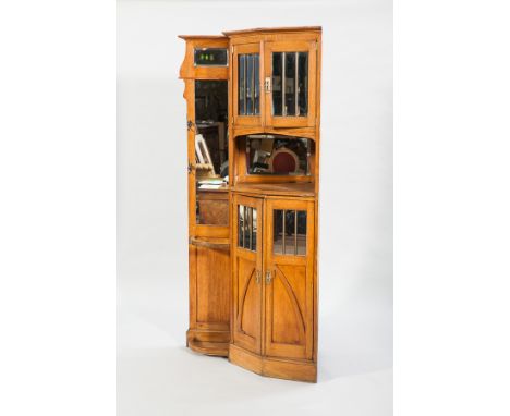 EDWARDIAN OAK CORNER HALLSTAND
the angled cupboards enclosed by mirrored panel door separated by an open recess, stick stand,