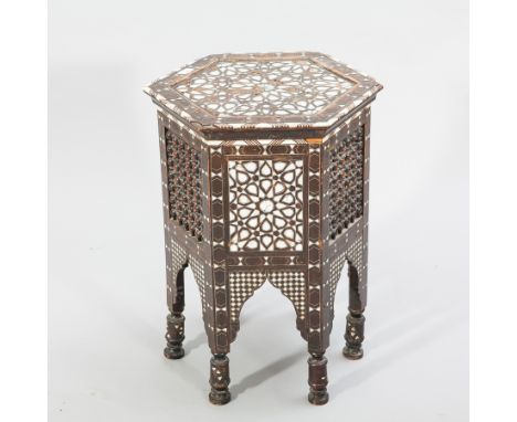MOORISH OCTAGONAL OCCASIONAL TABLE 
inlaid with mother of pearl and with bobbin turned side panels, 48cm wide