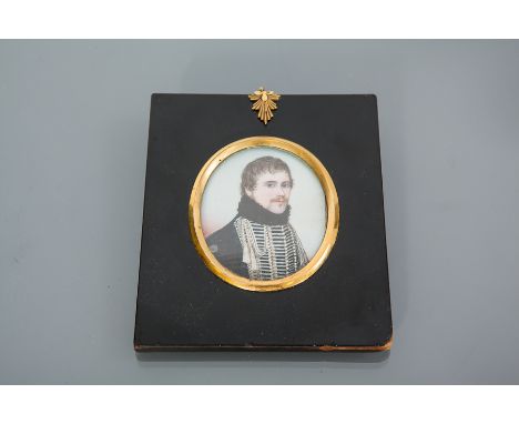 19TH CENTURY OVAL MINIATURE PORTRAIT
depicting a young moustacheod officer, 7.5cm x 6.5cm, framed and under glass