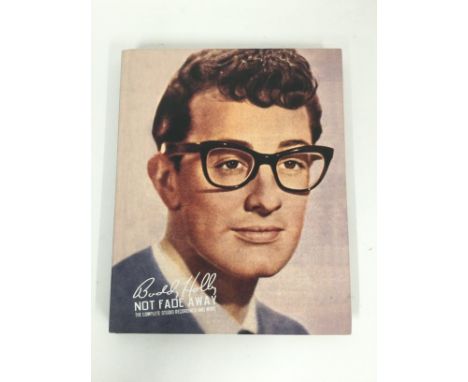 A Buddy Holly 'Not Fade Away - The Complete Studio Recordings And More' CD box set and book together with a Fats Domino CD lo