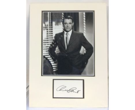 A mounted Cary Grant display comprising signature and photographic print, with COA. Approx 30cm x 40cm.