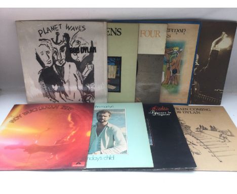 Sixteen singer songwriter LPs by various artists including Bob Dylan, John Martyn, Cat Stevens and others.