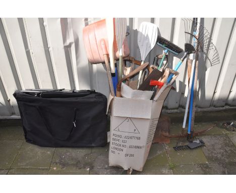 A FOLDING GARDEN LOUNGER CHAIR and storage bag, along with a box containing various hand tools, to include spades, shovels, r