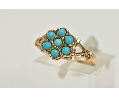 A 9CT GOLD TURQUOISE CLUSTER RING, flower shape cluster set with seven turquoise cabochons, yellow gold mount, openwork shoul