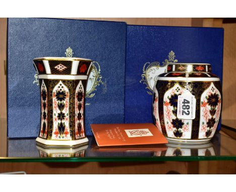 TWO PIECES OF BOXED ROYAL CROWN DERBY 1128 IMARI, comprising a ginger jar and cover, height 11cm and a waisted hexagonal vase