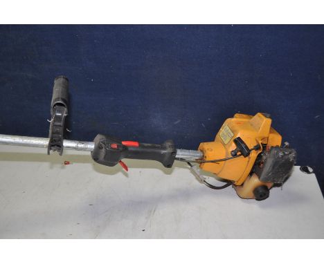 A PARTNER T240 PETROL STRIMMER (UNTESTED but engine pulling freely)