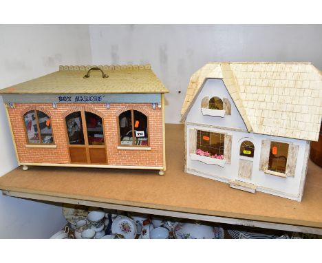 A WOODEN MODEL DRAPER'S SHOP AND DOLLS HOUSE, the draper's shop having access through the half opening roof to reveal two dol