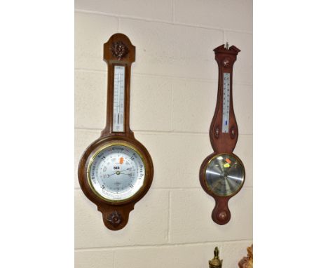 TWO ANEROID  BAROMETERS, banjo style, wall hanging, comprising an oak cased English Shortland Smiths barometer, having carved