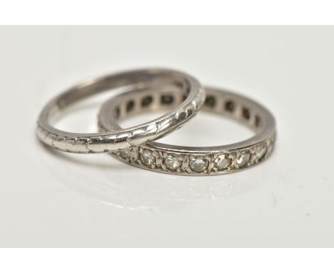 A WHITE METAL SINGLE CUT DIAMOND FULL ETERNITY RING AND A WHITE METAL FOLIATE BAND RING, the first estimated total diamond we