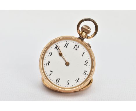 A YELLOW METAL OPEN FACE POCKET WATCH, manual wind, round white dial, Roman numerals, gold tone hands, within a plain polishe