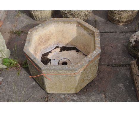 A COMPOSITE OCTAGONAL PLANTER, stamped Sandford stone, diameter 52cm x height 29cm