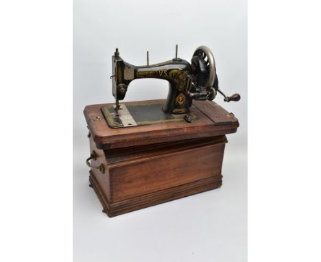 A BRADBURY'S FAMILY V.S. MANUAL SEWING MACHINE, in working condition with wooden case