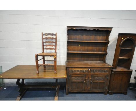 AN OAK DRESSER with a two tier plate rack and two drawers, width 130cm x depth 42cm x height 172cm x height of base 92cm, an 