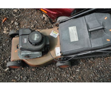 A BRIGGS AND STRATTON PETROL LAWNMOWER, with grass box (engine not turning)