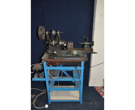 A VINTAGE MYFORD METAL WORKING LATHE with a 17in bed, belt drive by motor on separate frame, fitted with a 4in three jaw chuc