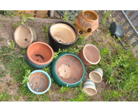 A TERRACOTTA STRAWBERRY PLANTER, along with eight various glazed planters on various sizes (9)