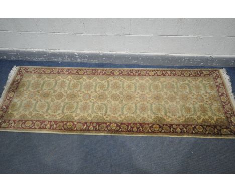 A G H FRITH WOOLEN INDU ZEIGLER GOLD AND ROSE CARPET RUNNER, 240cm x 75cm (condition:-some minor staining)