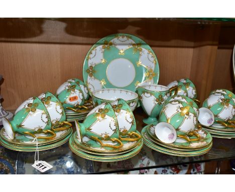 A THIRTY NINE PIECE 1930s ROYAL WORCESTER TEA SET, pattern number Z1357, with gilded flowers and foliate detail on an apple g