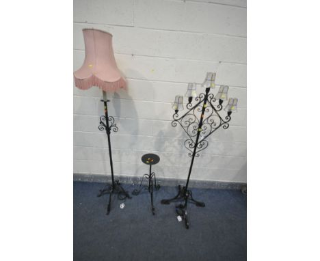 A WROUGHT IRON FIVE BRANCH STANDARD LAMP, all with small shades, with four legs, another wrought iron standard lamp and a tel