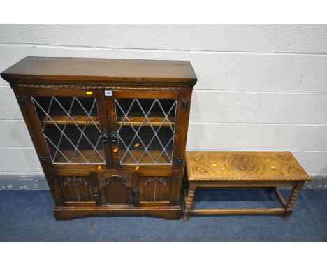 A LATE 20TH CENTURY OAK TWO DOOR LEAD GLAZED CABINET, with two bottom linenfold cupboard doors, width 84cm x depth 26cm x hei