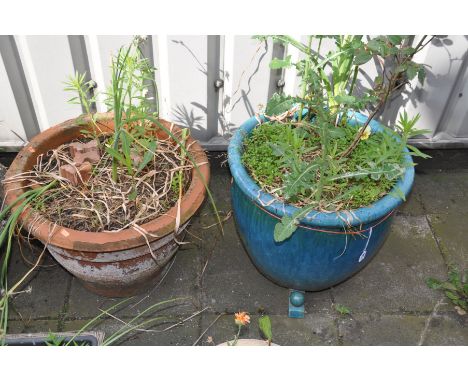 A PALE BLUE GLAZED CIRCULAR GARDEN PLANTER, raised on three supports, diameter 51cm x height 46cm, along with a terracotta ci