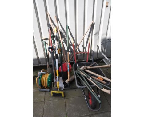 A QUANTITY OF GARDEN TOOLS, to include five spades, one shovel, outdoor brushes, axe, garden shears, hozelock hose reel with 