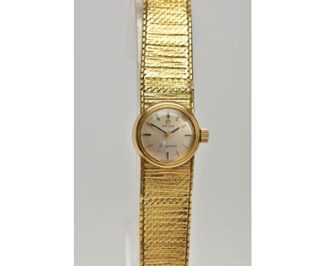 A LADIES 9CT GOLD 'OMEGA' WRISTWATCH, a hand wound movement, round silver tone dial signed 'Omega Ladymatic' baton markers, p