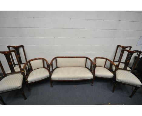 AN EDWARDIAN MAHOGANY SEVEN PIECE PAROLUR SUITE, comprising a sofa with open armrests, length 122cm on cylindrical turned fro