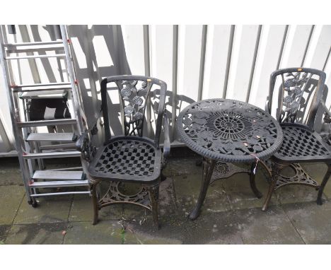 A PLASTIC CIRCULAR GARDEN TABLE, diameter 68cm x height 65cm and two armchairs, along with three various aluminium step ladde