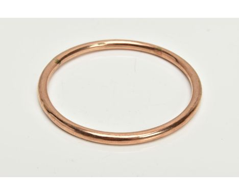 A ROSE GOLD TONE BANGLE, plain polished hollow bangle, stamped 9ct, approximate internal diameter 67.5mm, approximate gross w