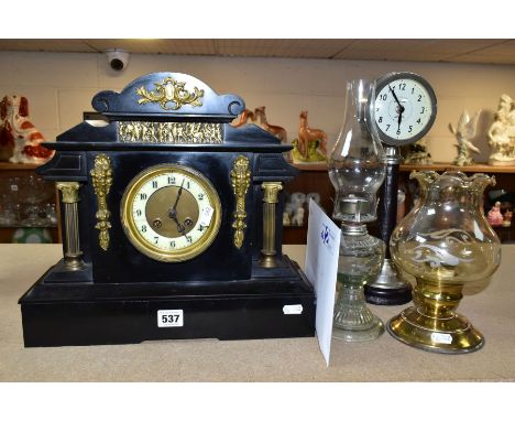 A LATE VICTORIAN BLACK SLATE MANTEL CLOCK OF ARCHITECTURAL FORM, enamel dial with Arabic numerals, cracked, eight day movemen