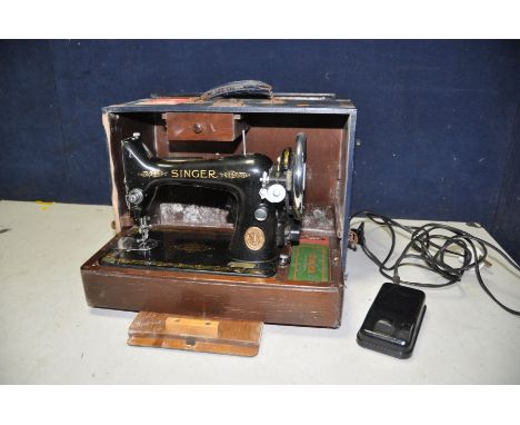 A SINGER SEWING MACHINE with foot pedal and light in blue case (PAT pass and working)