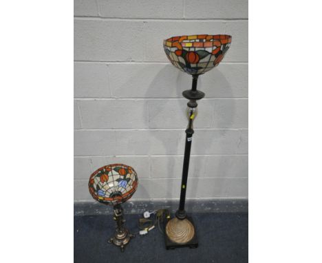 A METAL STANDARD LAMP, with a tiffany style floral lamp shade, a blown glass section, the base with plastic swirled decoratio