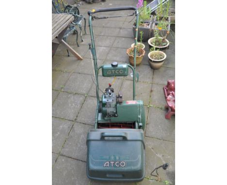 AN ATCO PETROL CYLINDER LAWNMOWER with grass box (engine turns freely)