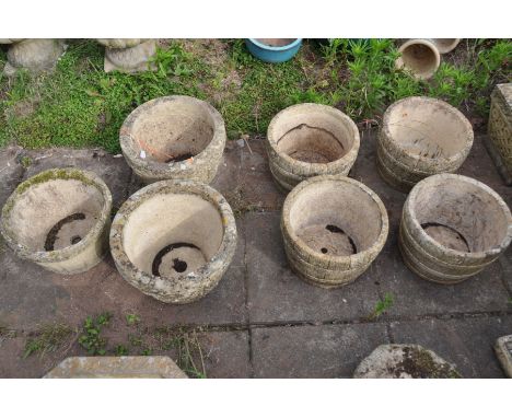 A SET OF FOUR COMPOSITE BARREL TYPE CIRCULAR PLANTERS, diameter 30cm x height 21cm, along with a pair of composite circular p
