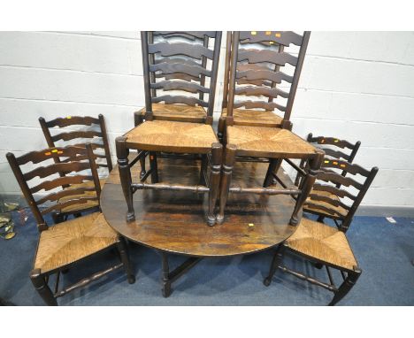 A GEORGIAN OAK OVAL GATE LEG TABLE, with a single drawer at each end, open length 154cm x closed length 52cm x depth 137cm x 