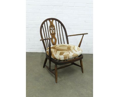 An Ercol fleur de lys open armchair, 70 x 80 x 52cm.