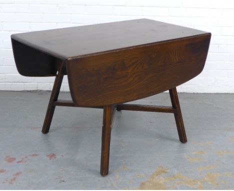 A vintage dark elm Ercol table, 125 x 73 x 113cm.