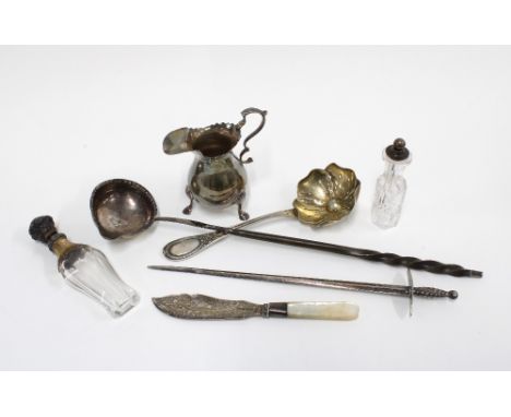 Britannia silver cream jug, marks rubbed,  Georgian silver toddy ladle, 34cm long, two glass scent bottles, silver plated let