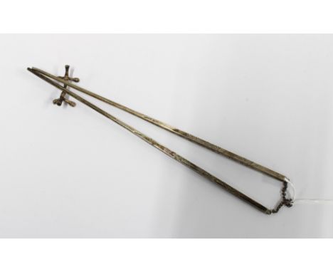A pair of silver chopsticks, stamped STERLING together with a faux bamboo chopstick rest , 23.5cm long
